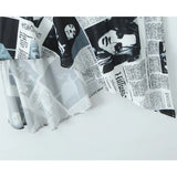 YENKYE New Women Newspaper Letter Print Irregular Hem Sling Dresses Fashion Backless Thin Straps With Chain Summer Sexy Dress