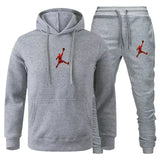 A 2-piece men's outdoor fitness sportswear set featuring a hooded long-sleeved sweatshirt, pullover and casual pants for autumn